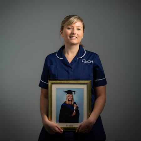 Dietitian holding a photo of her graduation photo
